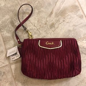 Coach maroon wristlet.